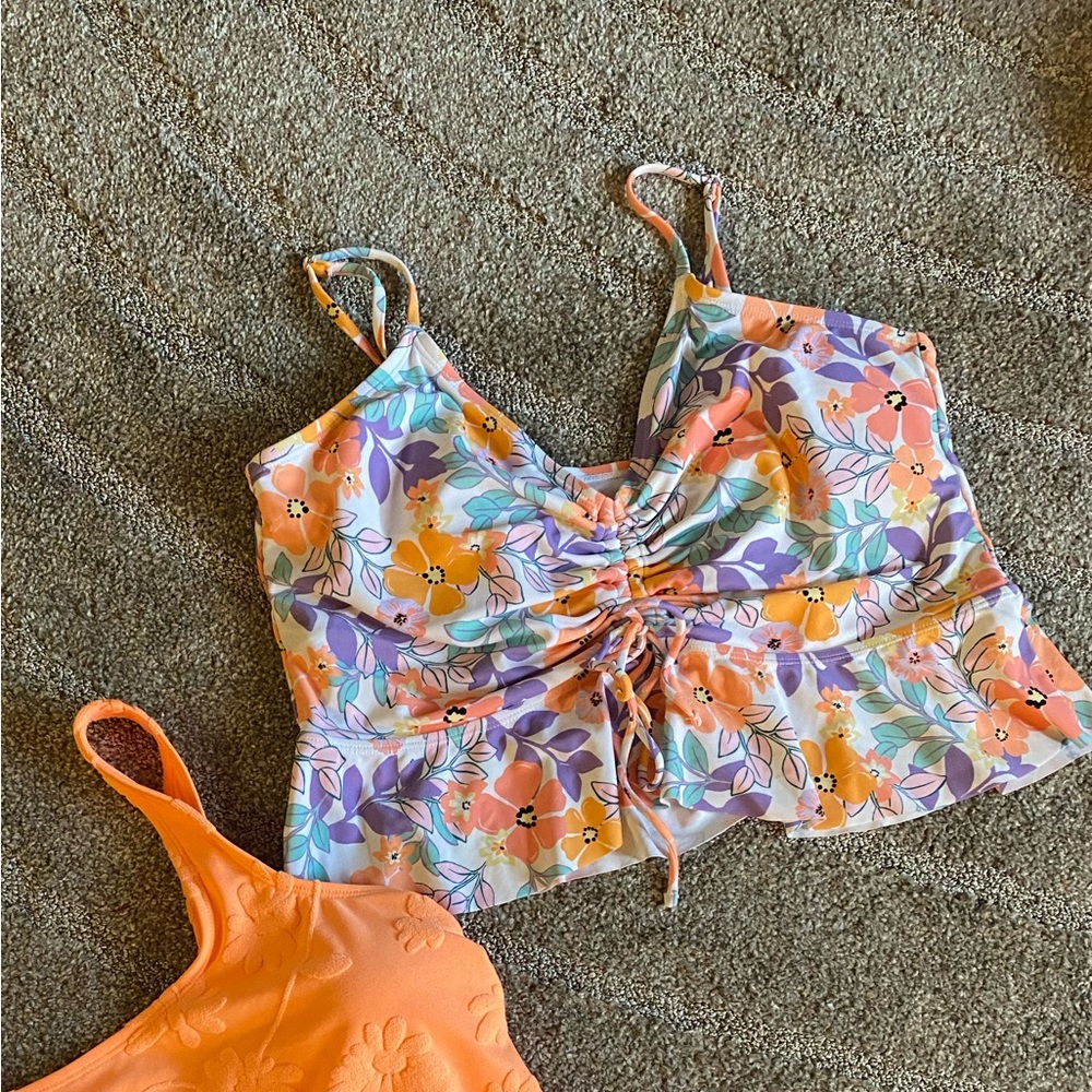 Two super cute bathing suit tops. 👙